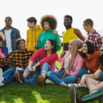 Diverse friends having fun outdoor during summer vacations - Diversity and multiethnic community