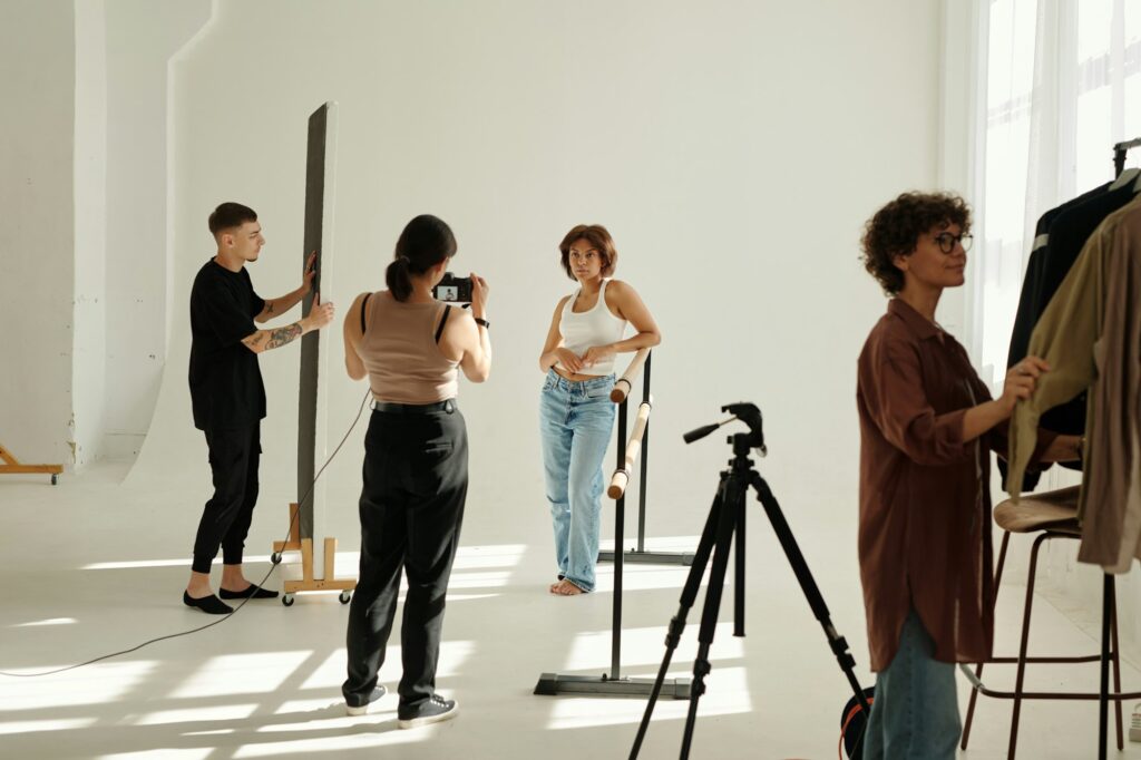 Long shot of shooting team carrying out their work during y2k fashion photo session