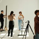 Long shot of shooting team carrying out their work during y2k fashion photo session