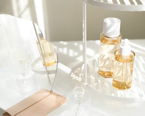 Skincare and cosmetic product with mirror and flower.