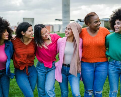Group of young women from different cultures spending time together