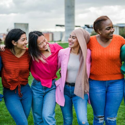 Group of young women from different cultures spending time together