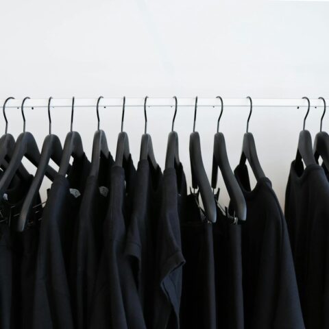 black clothes hanged in rack, dupe