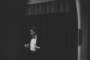 man in black vest and white dress shirt