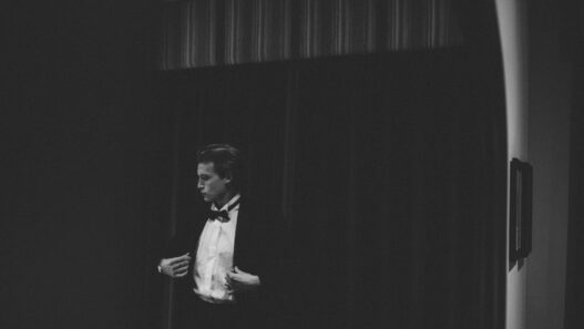 man in black vest and white dress shirt