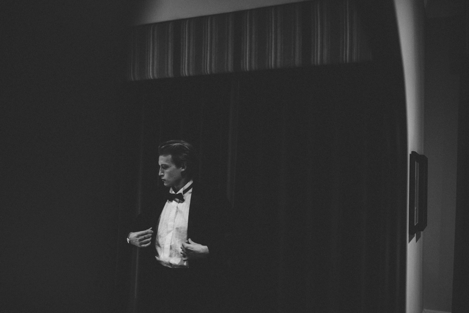 man in black vest and white dress shirt
