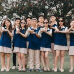 a group of young people standing next to each other