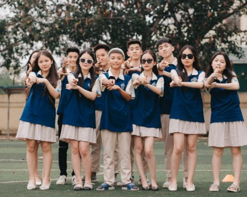 a group of young people standing next to each other