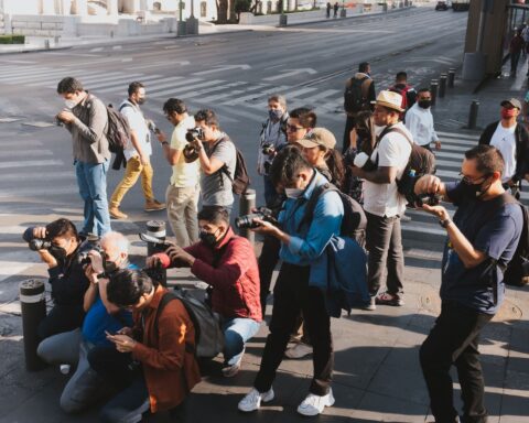 Press photographers at a red carpet event, illustrating entertainment and fashion legal work