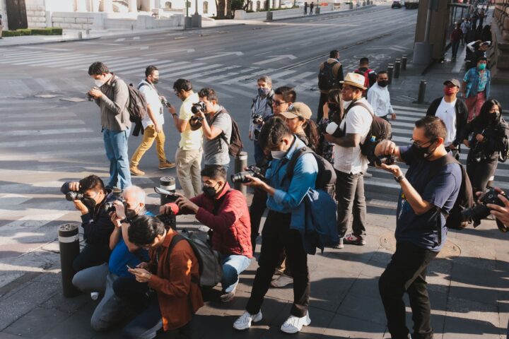 Press photographers at a red carpet event, illustrating entertainment and fashion legal work