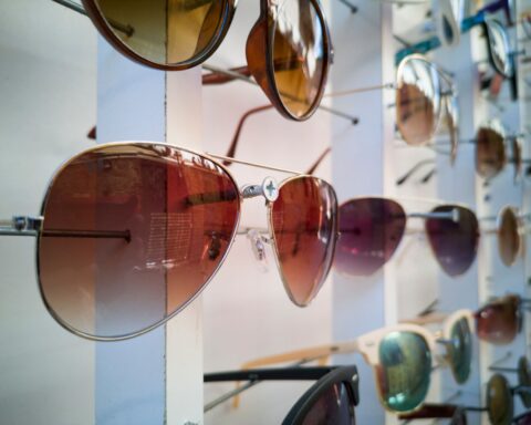 A display of sunglasses in varied styles, illustrating licensed eyewear ranges in fashion