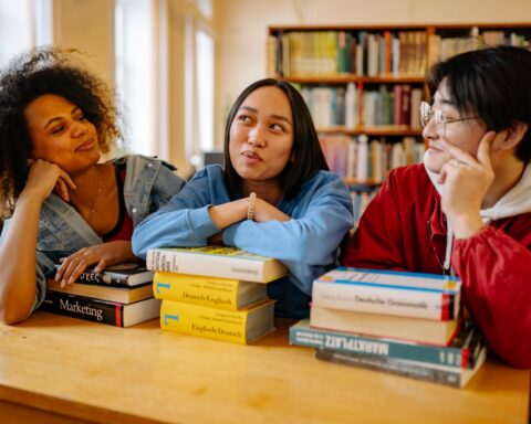 Students studying in a university library, illustrating where to study fashion law