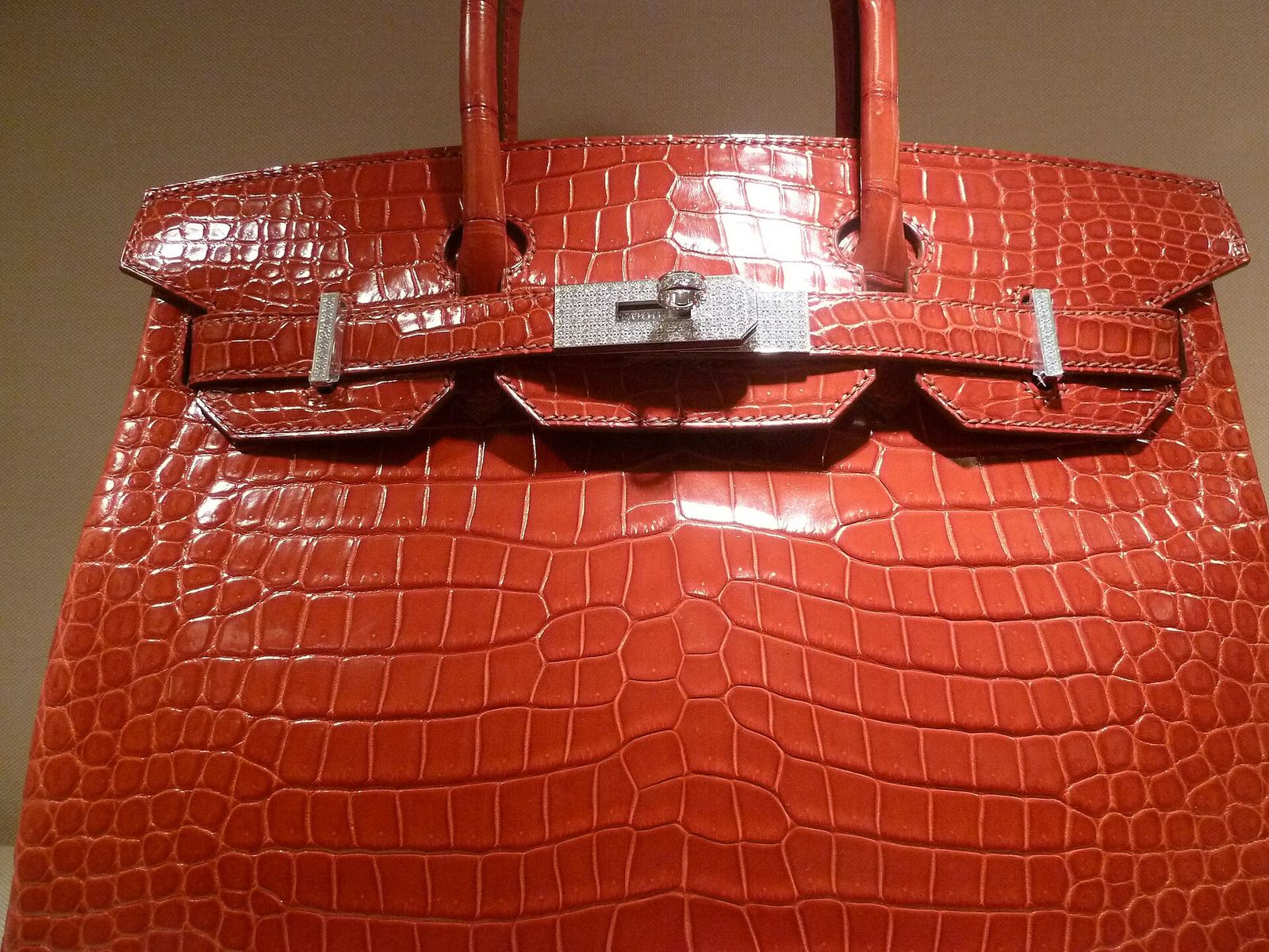 Red shiny crocodile Hermès Birkin with diamond-set hardware, the top tier of Birkin bag prices