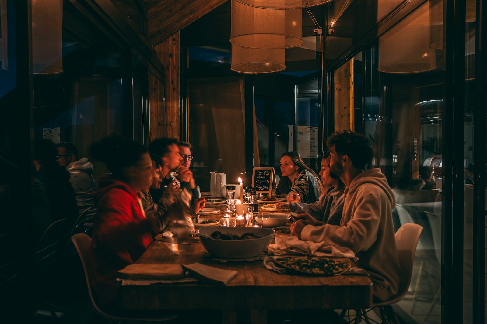 People at a candlelit restaurant dinner