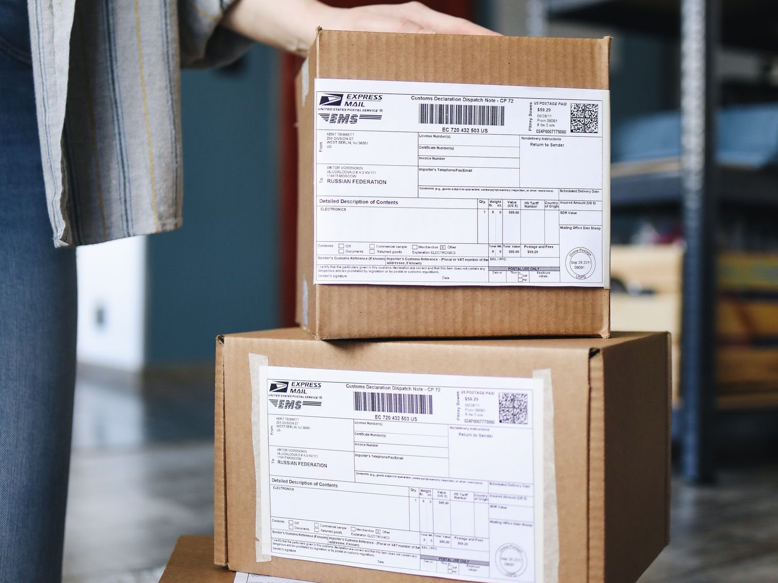 Stacked parcels with international customs labels, showing how de minimis changes hit Shein shipments