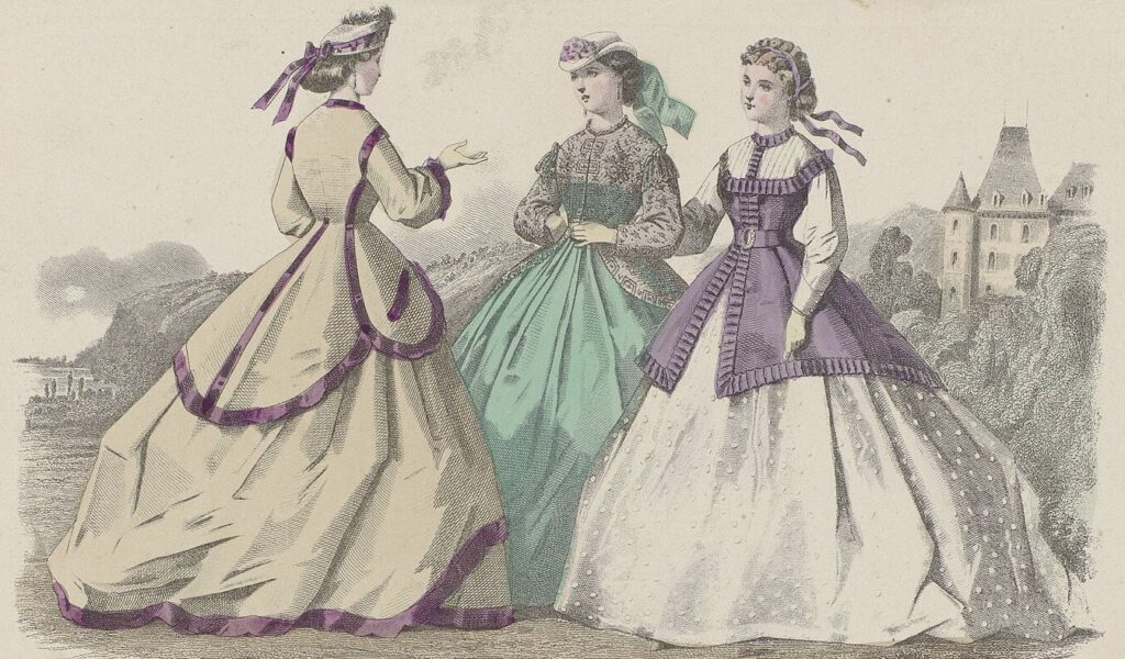 Hand-coloured 1865 fashion plate of three women in wide crinoline dresses, showing Victorian fashion